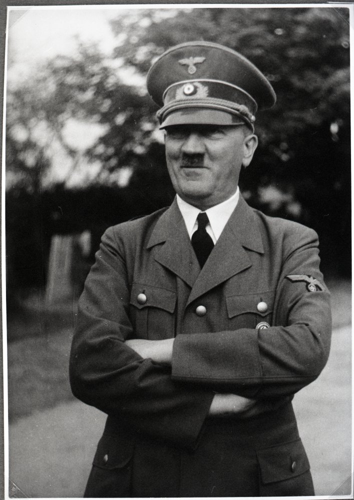 Hitler often wore a brown jacket, but traded it for a grey military uniform for public appearances later on. When did he start wearing the uniform?