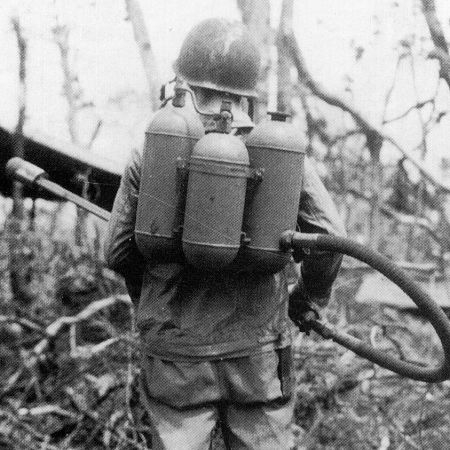 Can you identify this World War II-era flamethrower based on its distinctive tank shape?