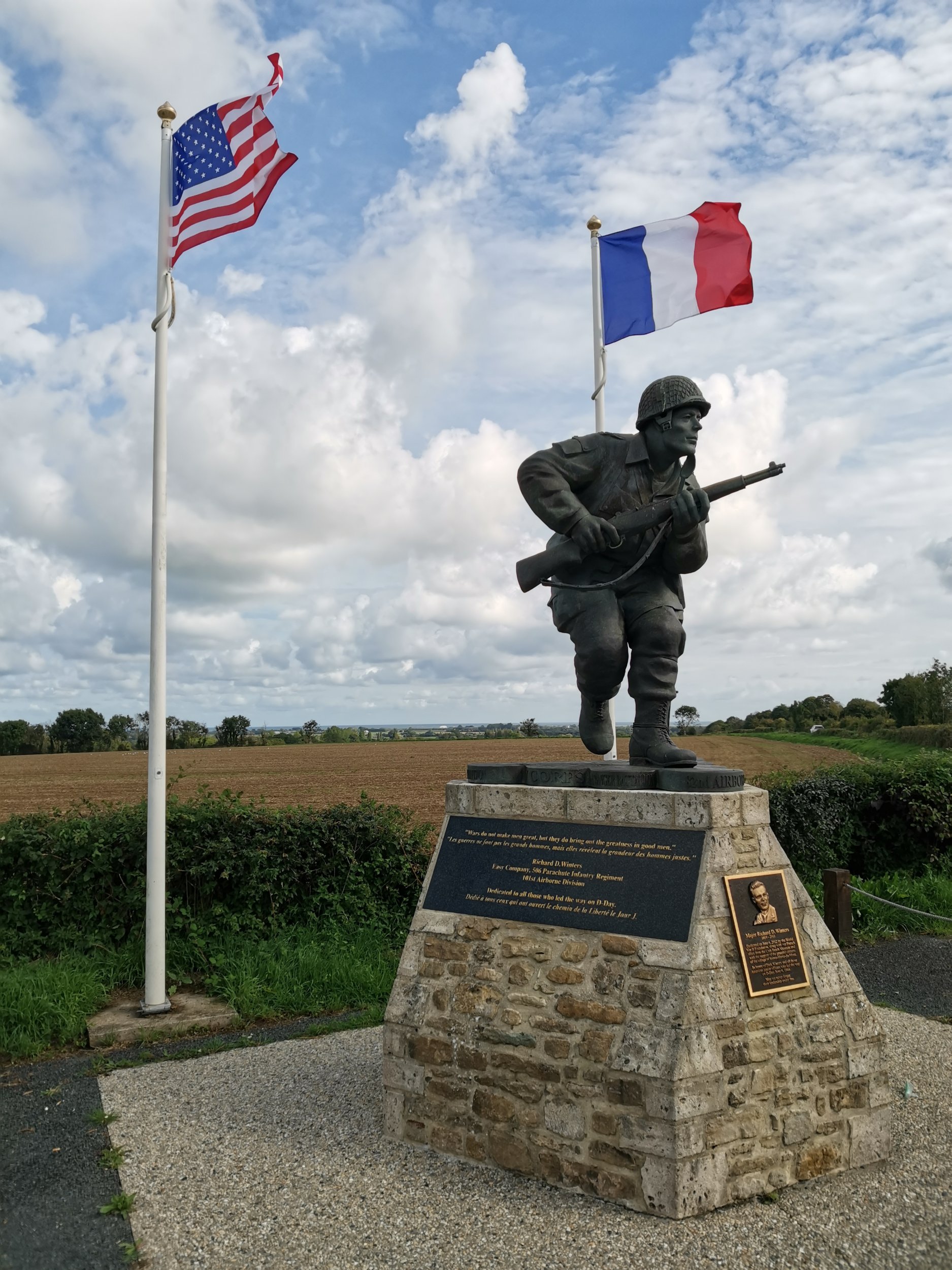 There is a statue of Dick Winters, the famous commander of Easy Company, 2nd Battalion, 506th Parachute Infantry Regiment, 101st Airborne Division, in the Normandy town of Sainte-Marie-du-Mont. Who or what is the statue dedicated to?