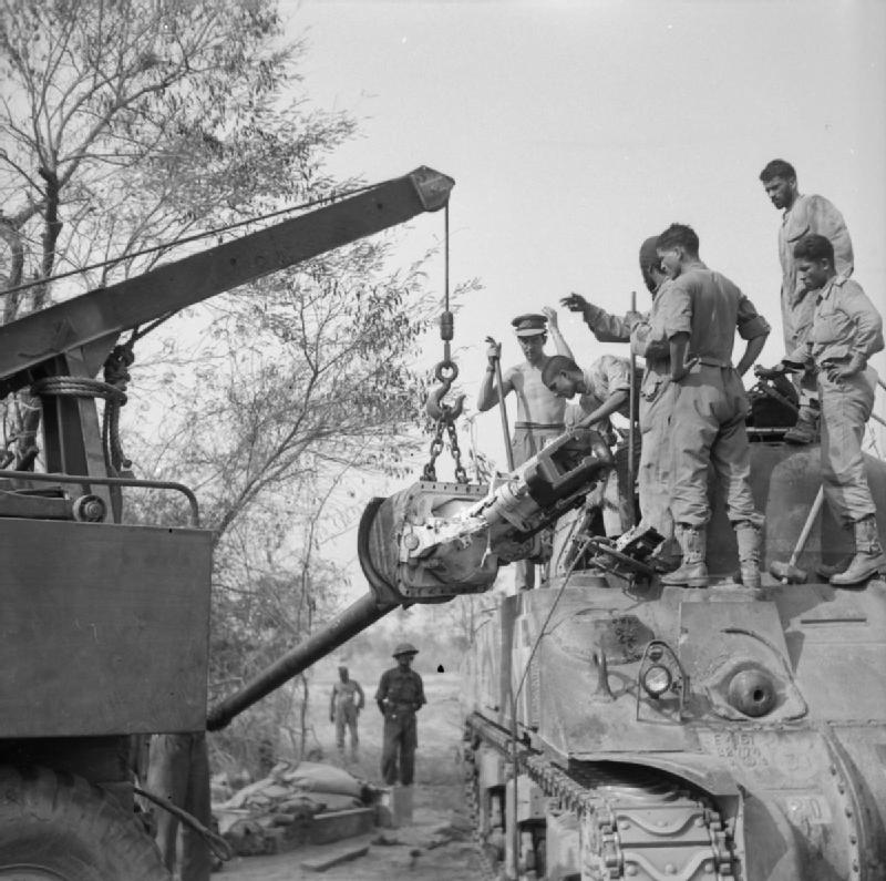 Why was the U.S. Army initially reluctant to replace the Sherman tank's 75 mm gun with a newer 76 mm one?